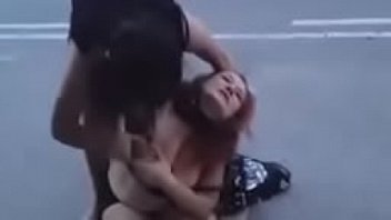 Naked girls fighting in public